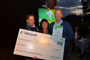Overall Winner (Cliff Donaldson, Northern Ireland, accepted on his behalf by Richard Halleron, Ireland). On the right: Benoit Passard of DeLaval and Executive Secretary Connie Siemes. Picture taken by Chuck Zimmerman.